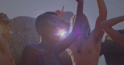 Friends Enjoying Coastal Adventure in Vibrant Sunlight