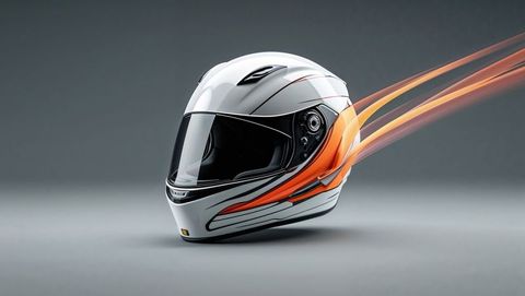 Sleek white motorcycle helmet with orange stripes, streamline profile