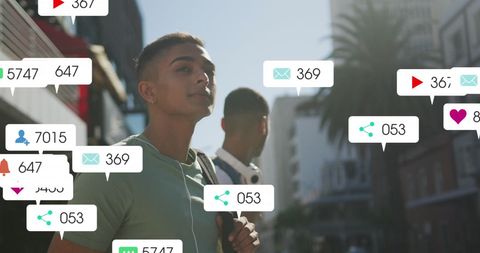 Young Man Engaged with Social Media Notifications Outdoors