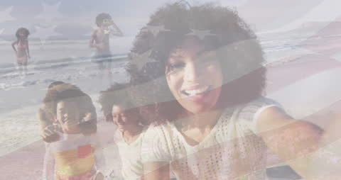 Happy Family Celebrating on the Beach with US Flag Overlay