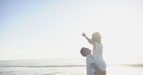 Joyful Couple Embracing Love in Serene Sunset Beach Silhouette - Download Free Stock Images Pikwizard.com