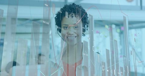 Businesswoman analyzing data with technology interface overlay