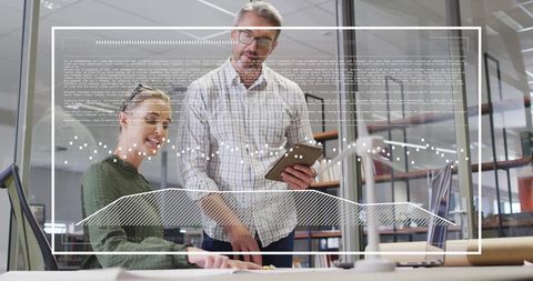 Business Team Analyzing Digital Financial Data in Modern Office Setting