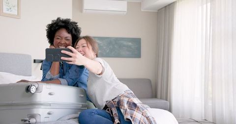 Diverse Lesbian Couple Enjoying Vacation Selfie Moments