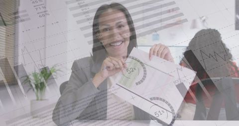 Smiling Businesswoman Presenting Data Charts in Modern Office