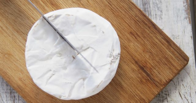 Slicing Brie Cheese Wheel on Wooden Cutting Board - Download Free Stock Images Pikwizard.com