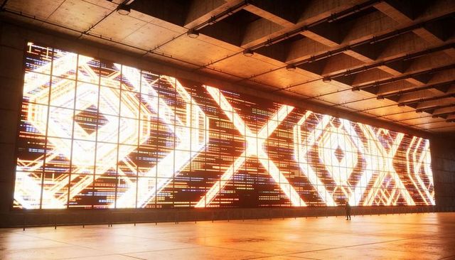 Displaying futuristic led wall with geometric amber patterns in industrial concrete hall