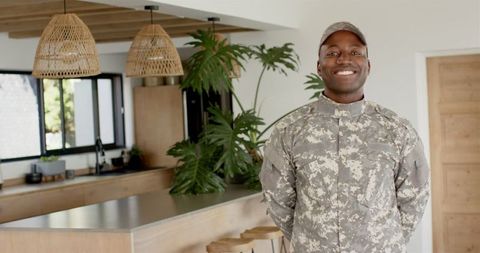 Smiling african american veteran in modern kitchen
