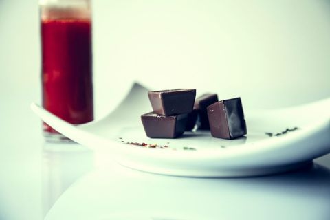 Close-up of gourmet chocolates on modern plate