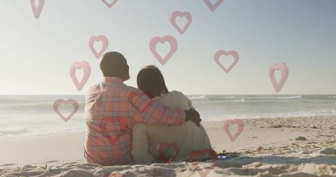 Romantic Couple Enjoying Serene Beach View with Heart Icons