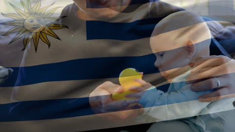 Father and Baby Bonding with Rubber Duck and Overlaid Uruguayan Flag