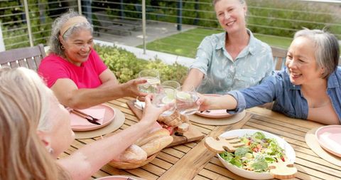 Senior Friends Celebrating Outdoor Friendship Lunch