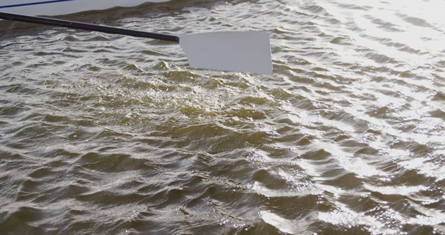 Close-up of Rowing Oar in Water Creating Ripples Outdoors - Download Free Stock Images Pikwizard.com