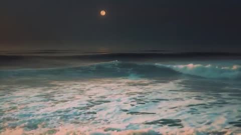 Moonlit Ocean Waves Crashing at Nighttime