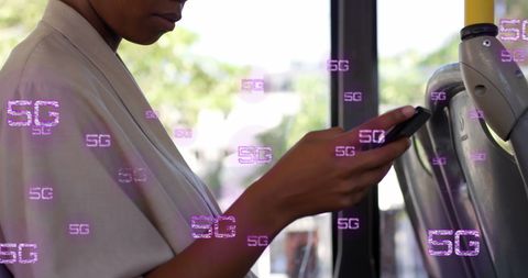 African American Woman Using Phone on Bus with 5G Technology