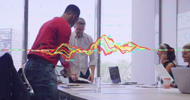 Colleagues Analyzing Data in Modern Office with Financial Graph - Download Free Stock Images Pikwizard.com