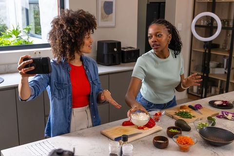 African American Friends Filming Cooking Vlog While Preparing Rice and Avocado