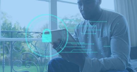 Man holding tablet and checking secure connection with holographic lock overlay at home