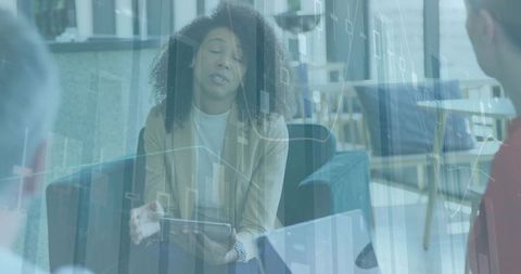 Businesswoman Discusses Data Analytics in Modern Office