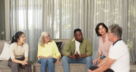 Diverse group in a supportive therapy session setting