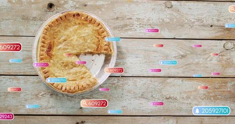 Rustic baked pie with flaky crust and missing slice on weathered wood with social ui tags