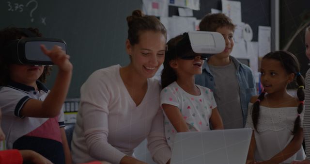 Teacher engaging diverse group of children with virtual reality technology in classroom. Ideal for content on modern education methods, STEM learning, technology in schools, and interactive teaching strategies.