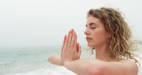 Peaceful Meditation Yoga on Beach with Eyes Closed