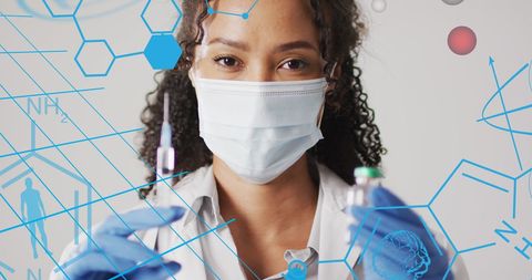 confident female doctor holding vaccine in futuristic lab - Download Free Stock Images Pikwizard.com