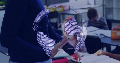 Teacher using tablet projecting holographic globe in classroom for digital learning and stem