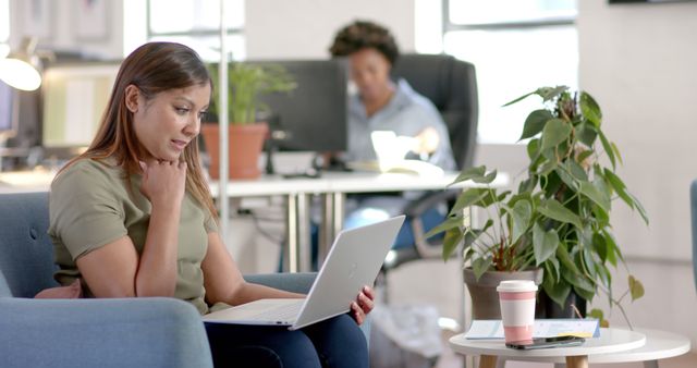 Young Woman Working Remotely with Laptop in Modern Office - Download Free Stock Images Pikwizard.com