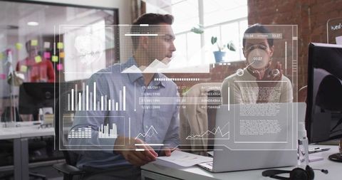 Colleagues analyzing AR data dashboard on laptop during collaborative office work