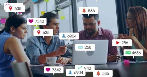Team Analyzing Social Media Metrics in Modern Workspace