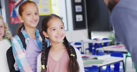 Smiling Students Engaged in Classroom Interaction