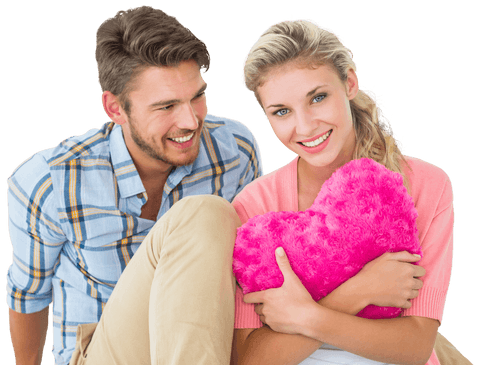 Happy Couple Sitting with Heart-Shaped Cushion Transparent Background