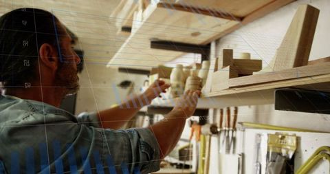 Carpenter in Workshop Analyzing Business Growth with Data Graph Overlay - Download Free Stock Images Pikwizard.com