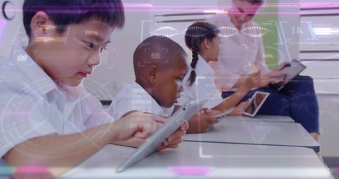 Elementary students using tablets, teacher guiding augmented reality classroom learning