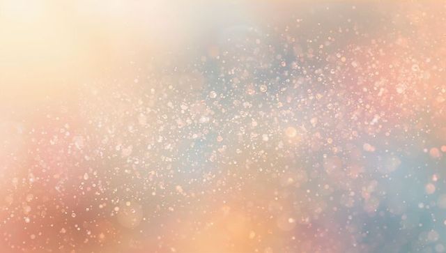 Ethereal pastel bokeh with glittering particles and soft gradient light