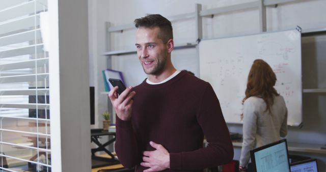 Happy Man Using Voice Command on Smartphone in Modern Office - Download Free Stock Images Pikwizard.com