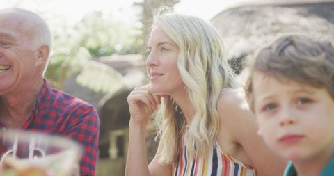 Happy Caucasian Family Enjoying Outdoor Dinner in Garden