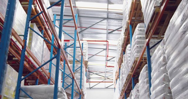 Industrial Warehouse with High-Stacked Shelves and Packaged Goods - Download Free Stock Images Pikwizard.com