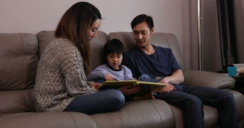 Asian Parents Reading with Child, Enhancing Family Bonding at Home - Download Free Stock Images Pikwizard.com