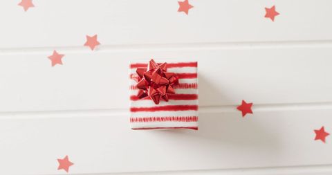 Red and White Striped Gift Box with Stars on Wooden Surface - Download Free Stock Images Pikwizard.com