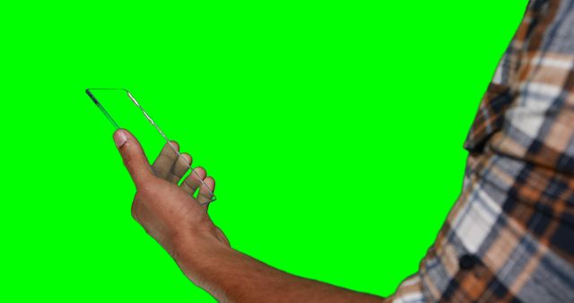 Man Holding Transparent Smartphone with Green Background - Download Free Stock Images Pikwizard.com