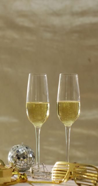 Two Glasses of Champagne with Mini Disco Ball - Download Free Stock Images Pikwizard.com