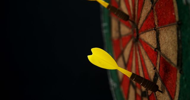 Yellow Darts Hitting Bulls-eye on Colorful Dartboard - Download Free Stock Images Pikwizard.com