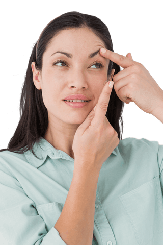 Woman applying contact lens, clear visual