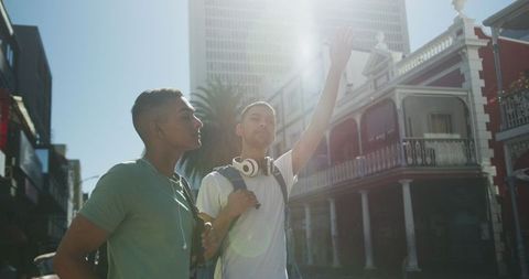 Two Friends Catching Cab During City Travel Adventure
