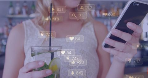Engaging with Social Media while Relaxing in a Bar - Download Free Stock Images Pikwizard.com