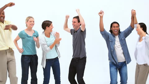 Group of Diverse People Jumping with Joy Indoors