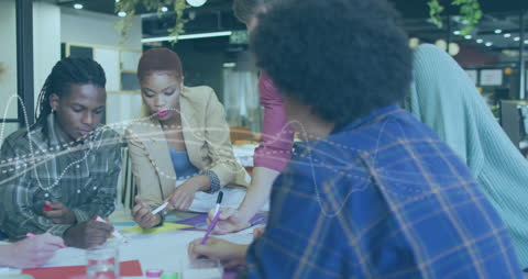 Creative Team Collaborating on Project in Modern Office Space